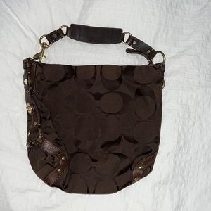 Brown coach purse with gold accents